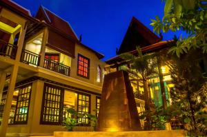 a building with a statue in front of it at THE PRIVILEGE FLOOR by Borei Angkor in Siem Reap