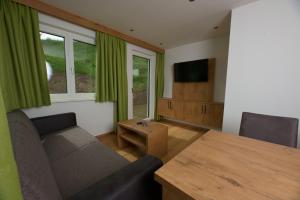 A television and/or entertainment centre at Mounira Ladis