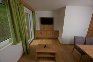 A television and/or entertainment centre at Mounira Ladis