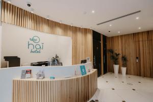 a lobby of a hotel with a reception desk at Hai Hotel in Larnaca