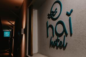 a wall with a sign that says zoo on it at Hai Hotel in Larnaca