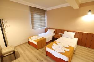 Postel nebo postele na pokoji v ubytování Luna Piena Hotel