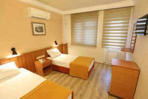 Postel nebo postele na pokoji v ubytování Luna Piena Hotel