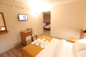 Postel nebo postele na pokoji v ubytování Luna Piena Hotel