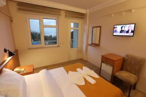Postel nebo postele na pokoji v ubytování Luna Piena Hotel