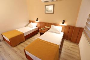Postel nebo postele na pokoji v ubytování Luna Piena Hotel