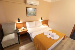 Postel nebo postele na pokoji v ubytování Luna Piena Hotel