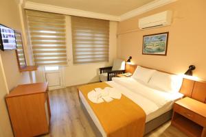 Postel nebo postele na pokoji v ubytování Luna Piena Hotel
