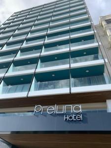a building with a sign on the side of it at The Preluna Hotel in Sliema