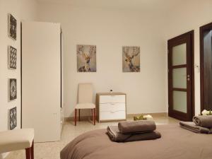 a bedroom with a bed and a dresser and a mirror at Large apartment close to rocky beach MCRE1-1 in Sliema