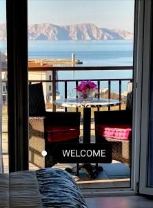 a balcony with a table and a view of the ocean at Beautyful sea view 6 luxury studio Danijela in Senj