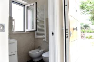 Kúpeľňa v ubytovaní Geranio Apartment - Villaggio di Mary + 4 fotografie