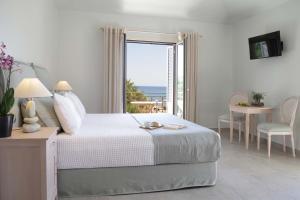 Postel nebo postele na pokoji v ubytování Costa Rossa Boutique Hotel - Adults Only + 37 fotografií