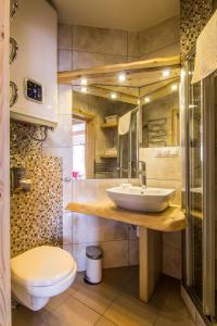 Kúpeľňa v ubytovaní Apartamenty Tatra View Kościelisko
