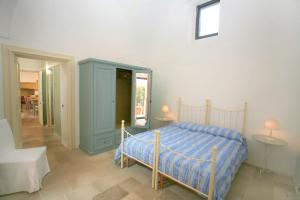 Tempat tidur dalam kamar di Old Patù House