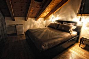Postel nebo postele na pokoji v ubytování The Cozy Nest - Bellano