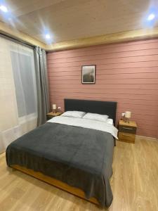 Un pat sau paturi într-o cameră la Klub Otdyha Liubogorie