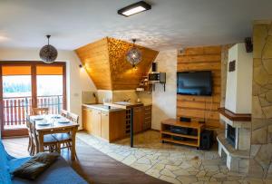 Kuchyňa alebo kuchynka v ubytovaní Apartamenty Domino - Kościelisko