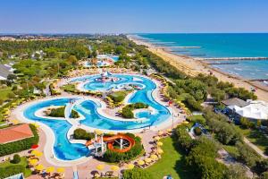 an aerial view of a water park next to a beach at Estivo Premium Plus mobile homes on Camping Pra delle Torri in Caorle