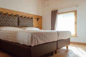 Bioagritur La Casa dei Trajeri客房内的一张或多张床位