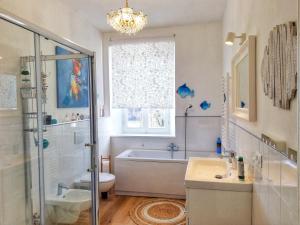 a bathroom with a tub and a toilet and a sink at La mia Casa nelle Marche in Ripatransone +65 photos