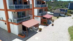 an overhead view of a building with red awnings at Terrazas De Punta Colorada in Piriápolis