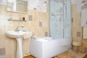 a bathroom with a sink and a shower at 1 Bedroom House 20min walk to centre in Tournus in Tournus +18 photos
