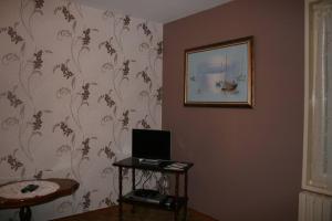 a room with a table and a picture on the wall at 1 Bedroom House 20min walk to centre in Tournus in Tournus
