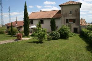 a house with a yard with trees and a building at 1 Bedroom House 20min walk to centre in Tournus in Tournus
