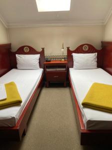 Postel nebo postele na pokoji v ubytování Hotel Kamel