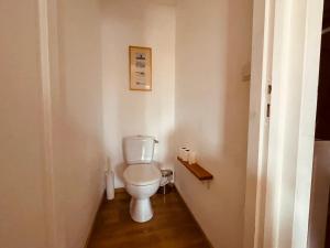 a bathroom with a white toilet in a room at Maison Bois du Bassin in Andernos-les-Bains +18 photos