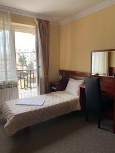 Postel nebo postele na pokoji v ubytování Hotel Kamel