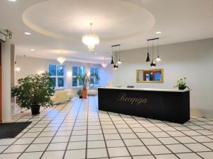 a lobby of a hotel with a reception desk at Sosnowe Zacisze Barszczewo in Choroszcz