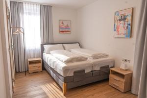 a bedroom with a bed in a room at Hotel Dortmunder Hof in Würzburg