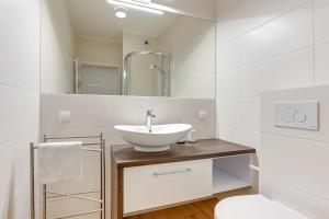Kúpeľňa v ubytovaní Apartament Nadmorskie Spektrum & Parking + 25 fotografií