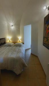 a bedroom with a large bed with two pillows at Appartement "POULAIN" en Centre-ville linge inclus in Blois