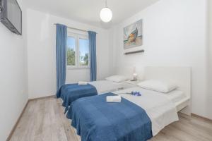 Postel nebo postele na pokoji v ubytování Villa Tara ZadarVillas