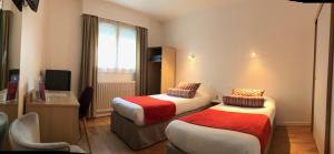 מיטה או מיטות בחדר ב-Cit'Hotel Atlantis