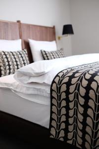 Postel nebo postele na pokoji v ubytování Parkhotel Obermenzing