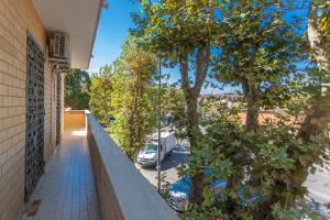 an apartment balcony with a view of a parking lot at Casa Vacanze Aurora in Fiumicino