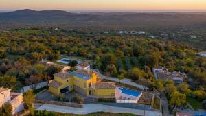 an aerial view of a house with a yard at Sunny House in Loulé