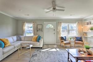 a living room with a couch and a table at Chic Charleston Home - Half Mile to Park Circle! in Charleston