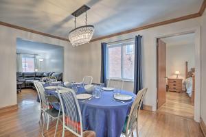 a dining room with a blue table and chairs at Pittsburgh Townhome about 5 Miles to Market Square in Pittsburgh