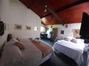 Postel nebo postele na pokoji v ubytování Dom Jaime - Guest House