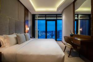 Ένα ή περισσότερα κρεβάτια σε δωμάτιο στο WAW Hotel Suites King Abdullah Road +20 φωτογραφίες
