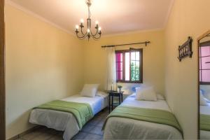 Posteľ alebo postele v izbe v ubytovaní Vivienda Vacacional La Finca + 24 fotografií