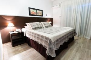 Ένα ή περισσότερα κρεβάτια σε δωμάτιο στο Veneto Hotel
