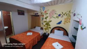 Postel nebo postele na pokoji v ubytování Hostal sambleño cusco Piero suite
