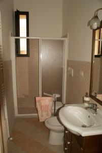a bathroom with a toilet and a sink at A Casa Di Silvia B&B in Sannicola