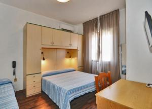 Postel nebo postele na pokoji v ubytování Hotel Antonella